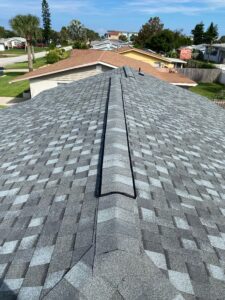 Completed Ormond By-the-Sea Florida roof replacement for an out-of-state homeowner, with Atlas Pinnacle Pristine shingles in Coastal Granite