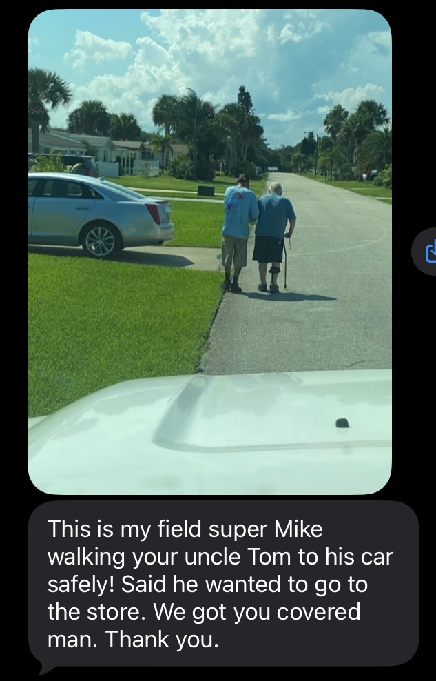 Text message from Pyramid Roofing FLA owner Donnie to homeowner Steve about the crew looking after his uncle. Pyramid Roofing FLA field supervisor Mike walking homeowner’s uncle safely to his car during the roof replacement.